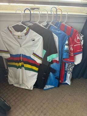 8 piece collection of men’s vintage cycling jerseys